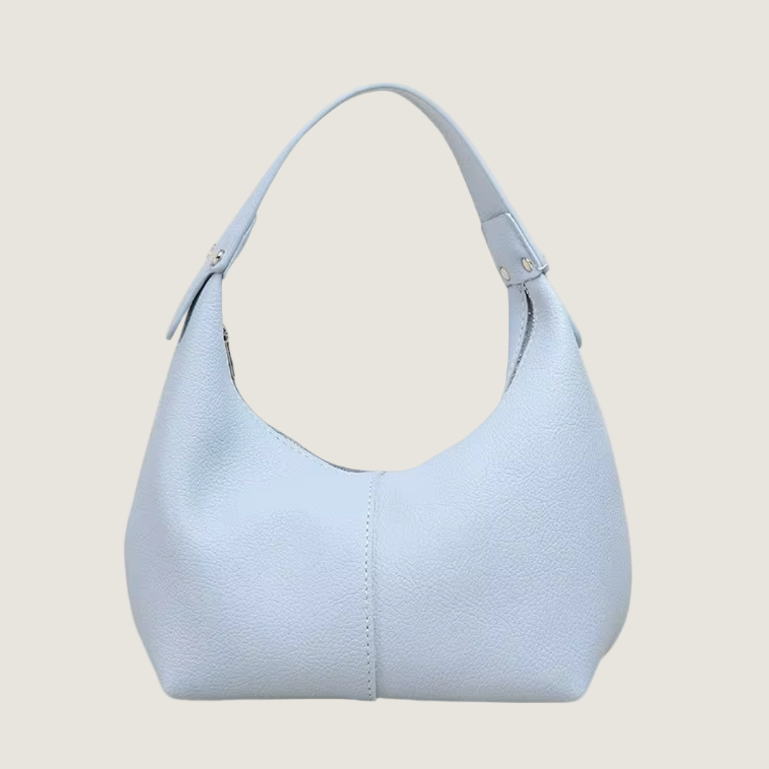Light blue handbag on a white background