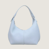 Light blue handbag on a white background