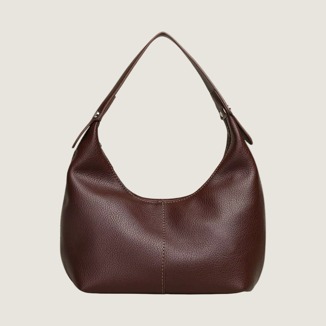 Brown leather handbag on a white background