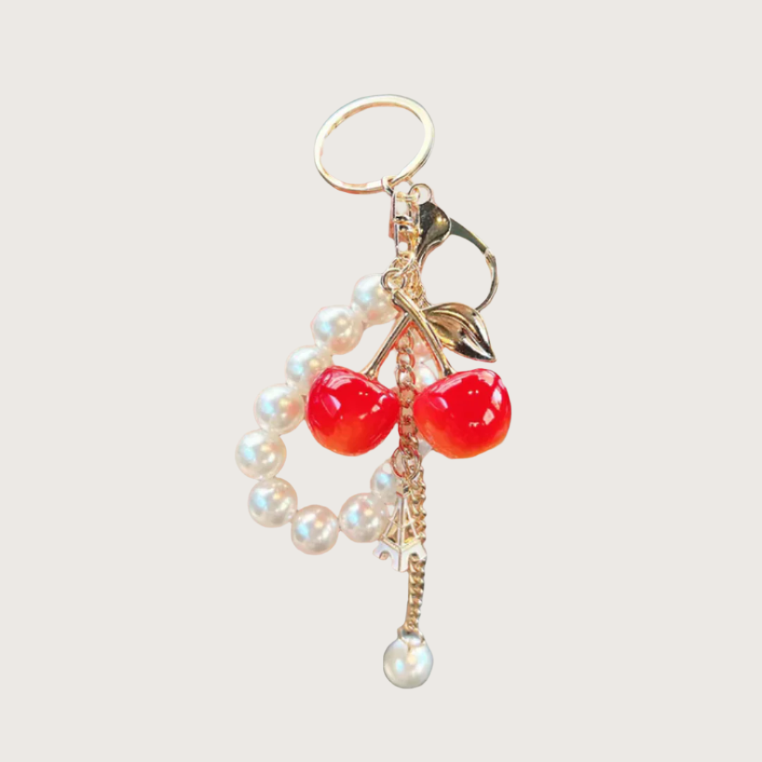 Bag Charm with red cherries and  white pearls.