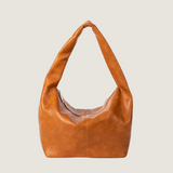 Brown leather handbag on a white background