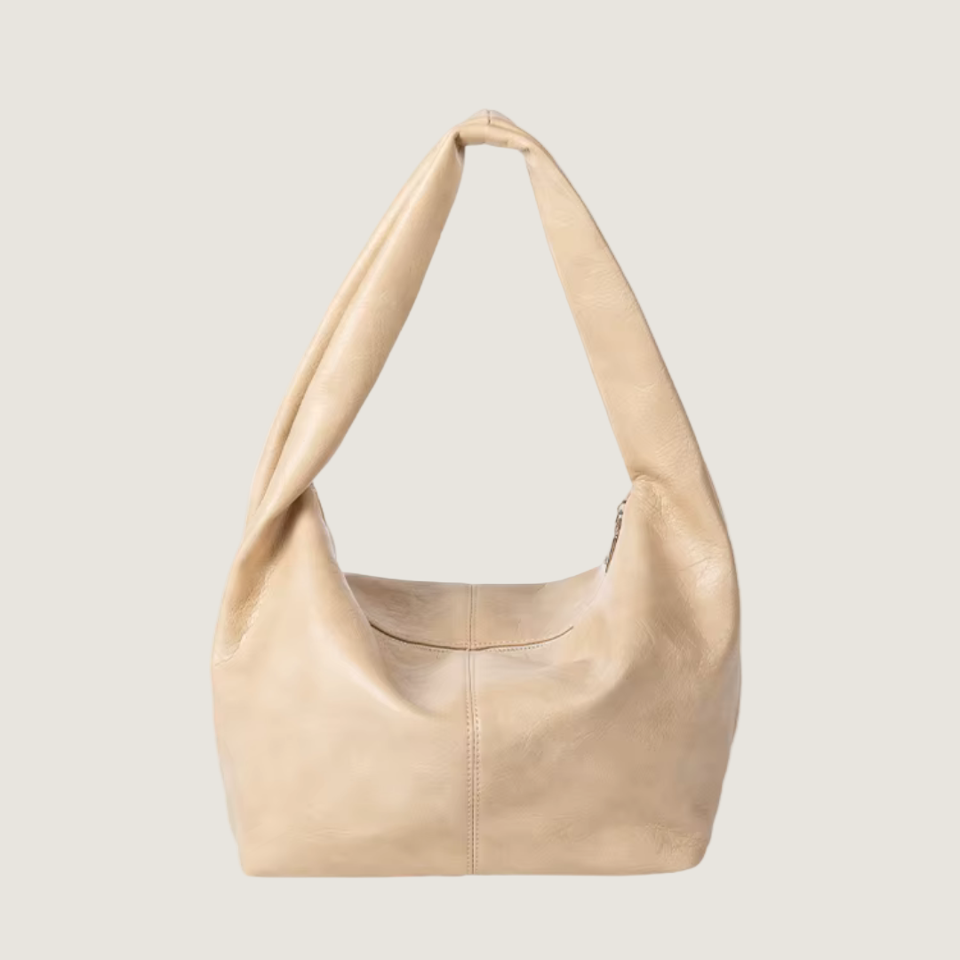 Beige handbag on a white background
