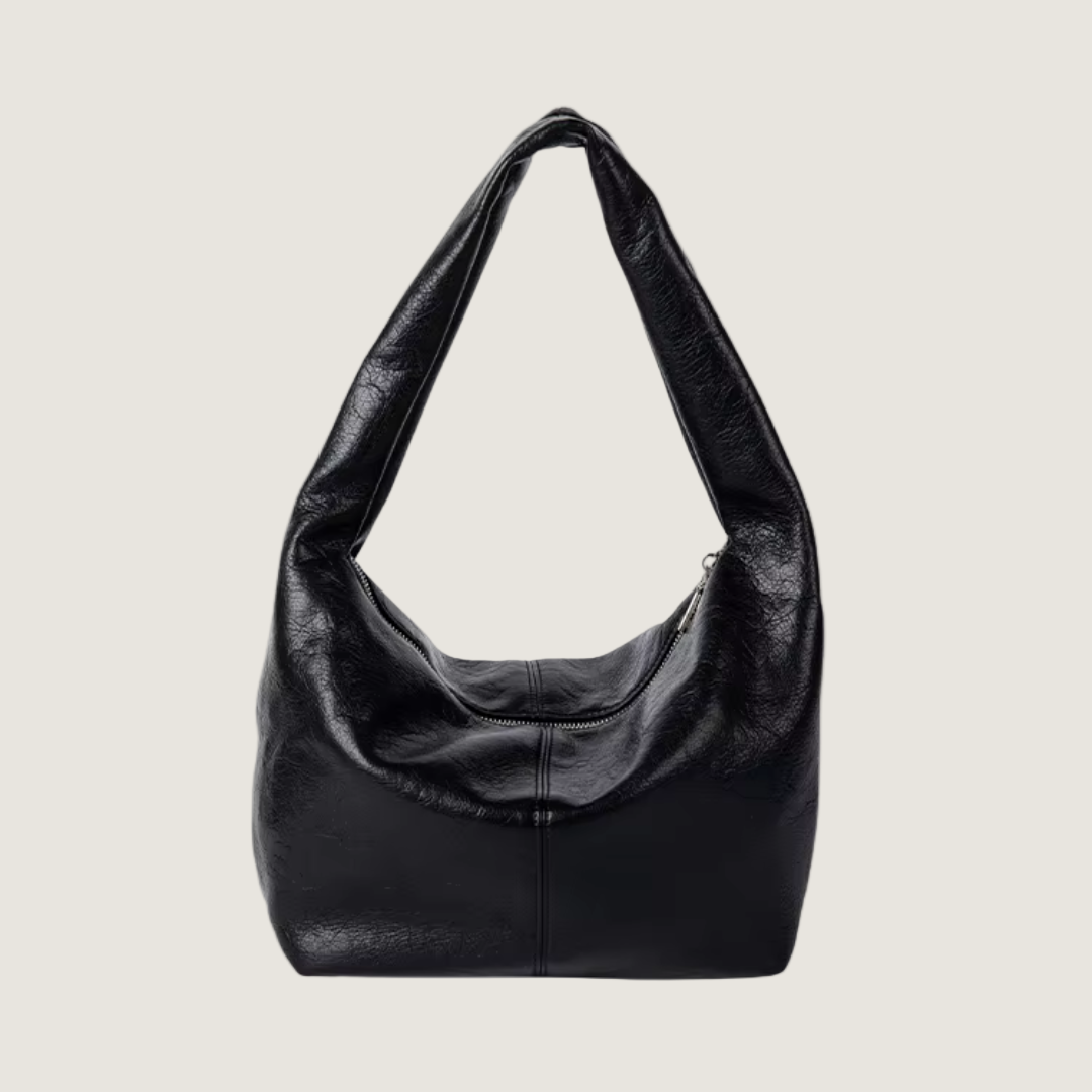 Black leather handbag on a white background