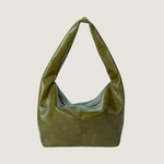 Green leather handbag on a white background