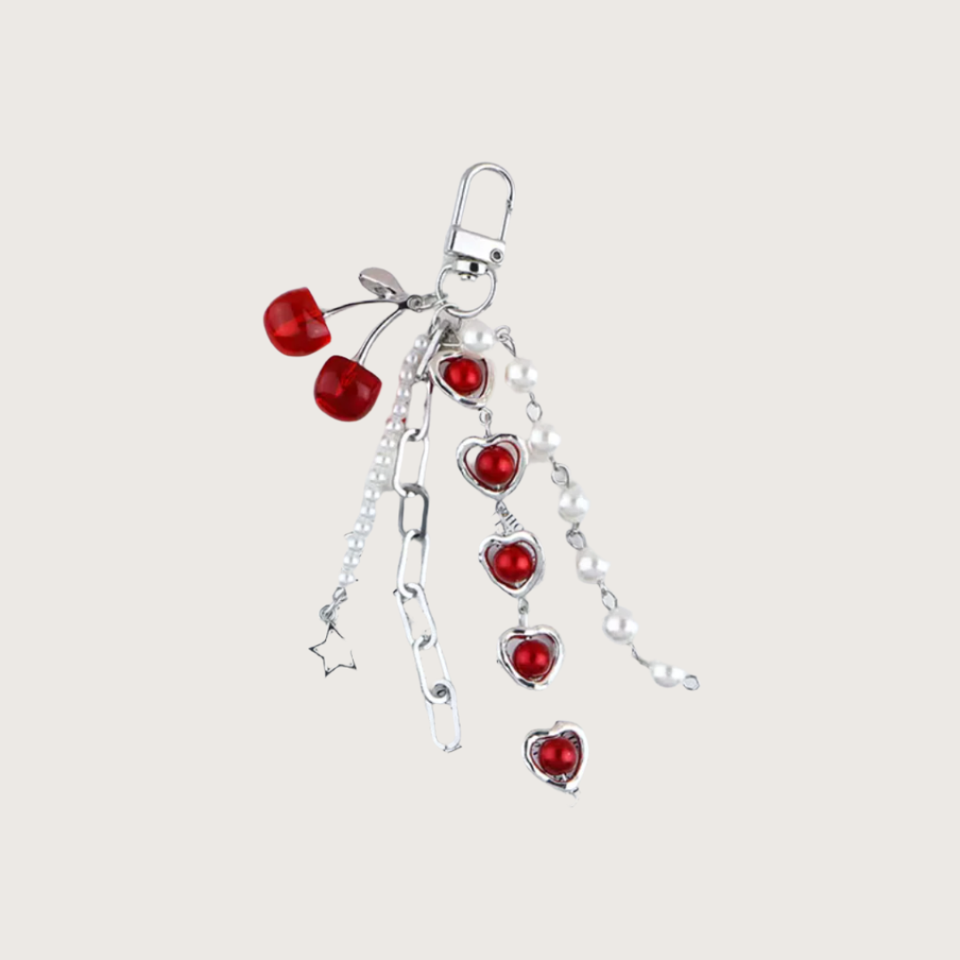 Keychain or bag charm with red hearts, chain and pearls.