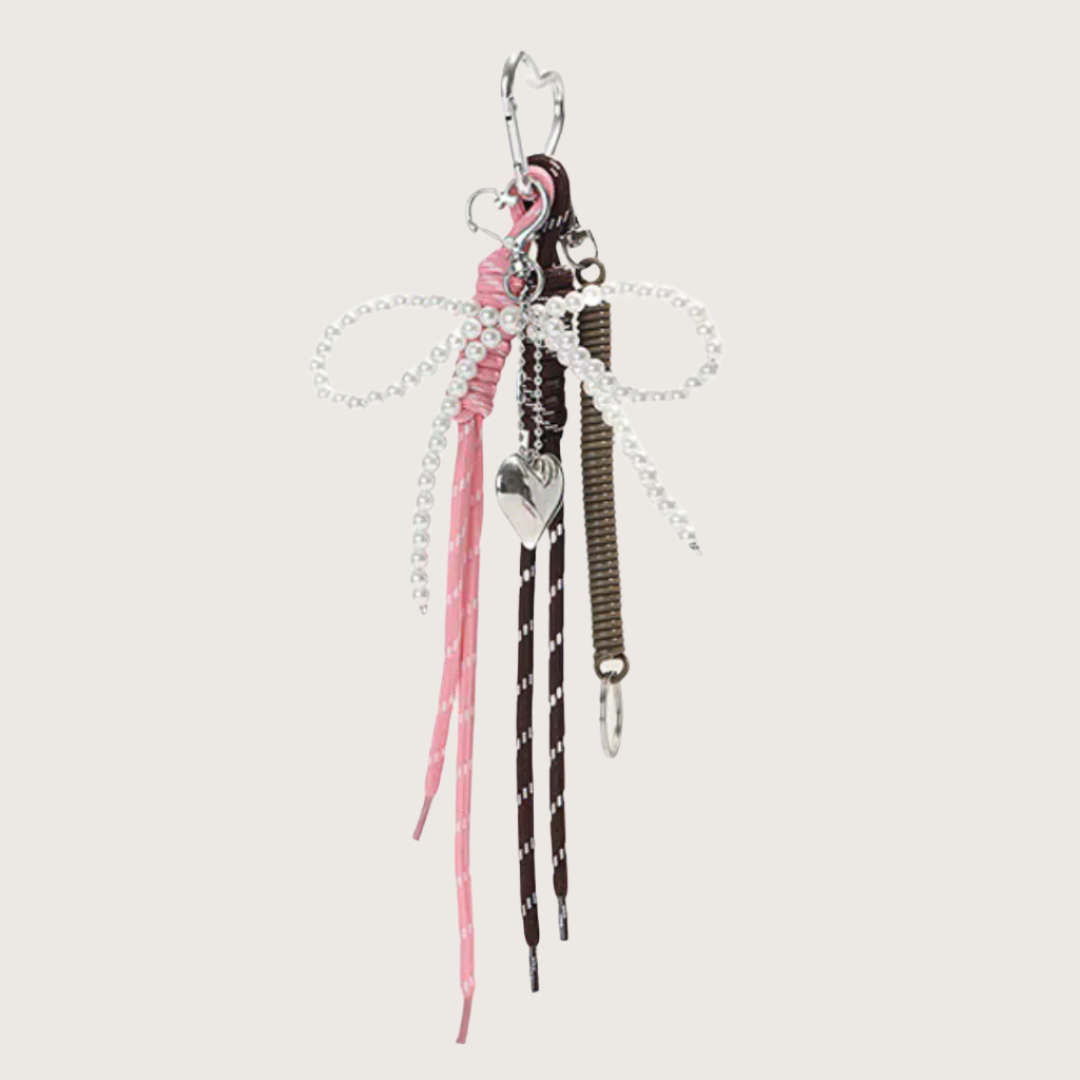 Decorative bag charm or keychain with ribbons, shoe lace and heart charm.