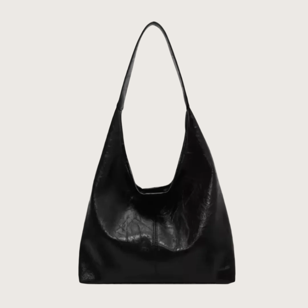 Black leather handbag on a white background