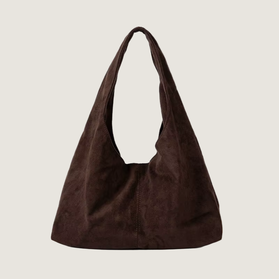 Brown suede handbag on a white background