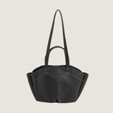 Black handbag with a strap on a white background