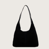 Black shoulder bag on a white background
